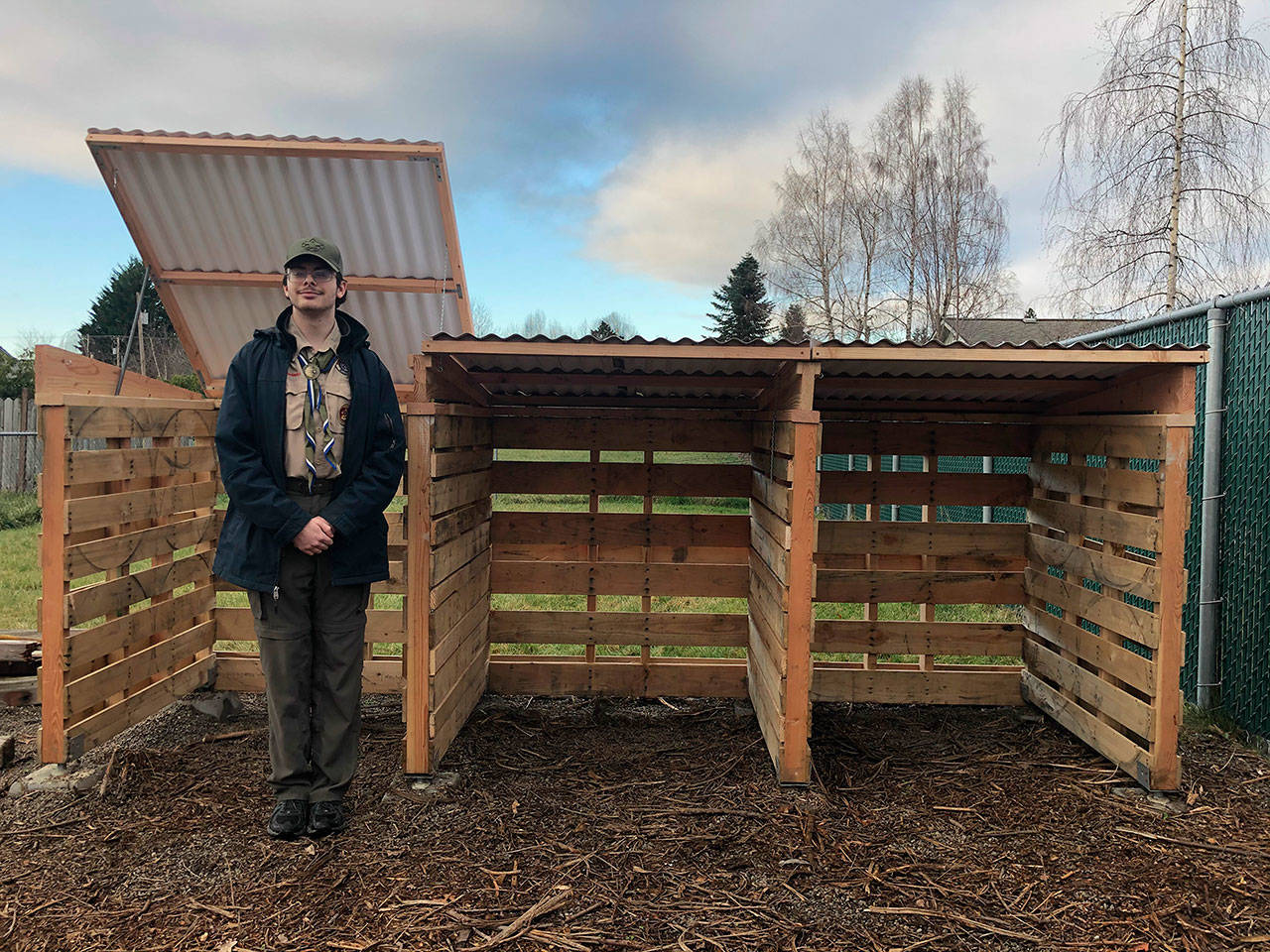 Devin Tompkin stands next to the compost bin he built for the Buckley Mountain View Community Garden. Courtesy photo