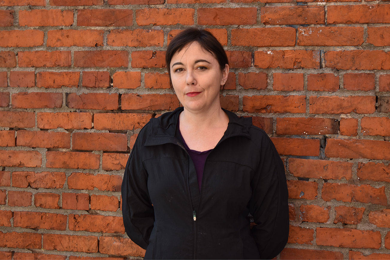 Erica C. Barnett, a Seattle journalist whose coverage includes city hall, homelessness and transportation, poses for a picture outside her Pioneer Square neighborhood office. Barnett was one of several speakers during the April 13 King County Conference on Addiction Disorders. Photo by Alex Bruell