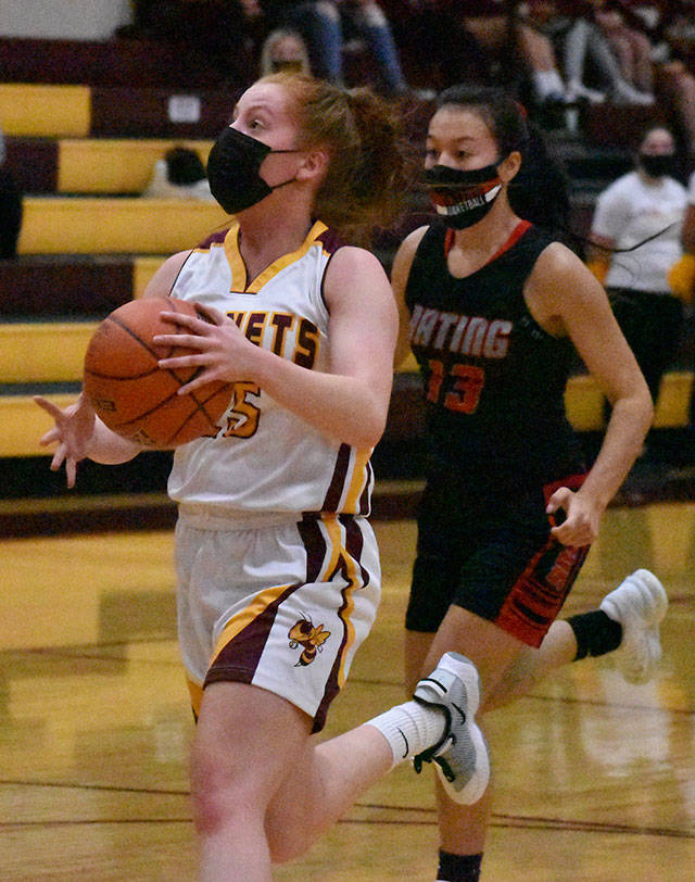 Kara Marecle became the seventh player in the history of White River girls’ basketball to score more than 1,000 points. Here, she drives for two more during Friday night’s home victory. Photo by Kevin Hanson