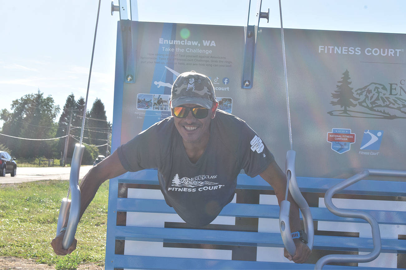 Francisco Pons demonstrates his upper body strength at one of the Fitness Court facilities. Photo by Alex Bruell.