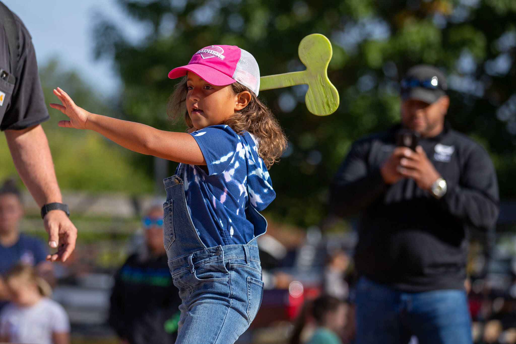 Jaeda Walker eyes her wooden ax throw. Photo by Ashley Britschgi.