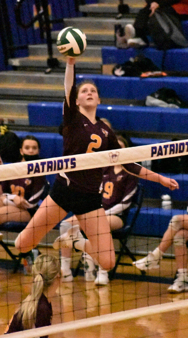 Elle Thomas goes high for a kill against North Kitsap, White River’s first opponent during last week’s district tournament. Photo by Kevin Hanson