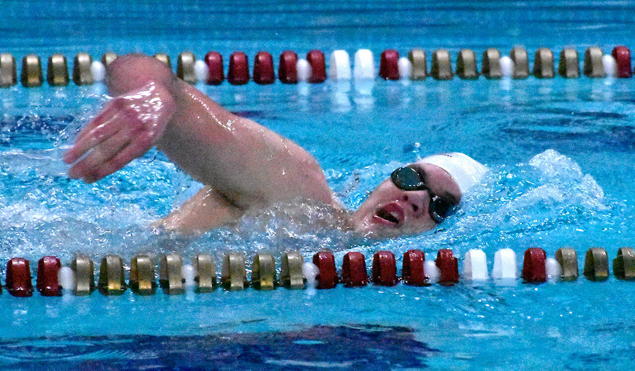 Enumclaw High swimmer McCade Walker competes in a freestyle event during a recent meet at the Enumclaw Aquatic Center. Photo by Kevin Hanson