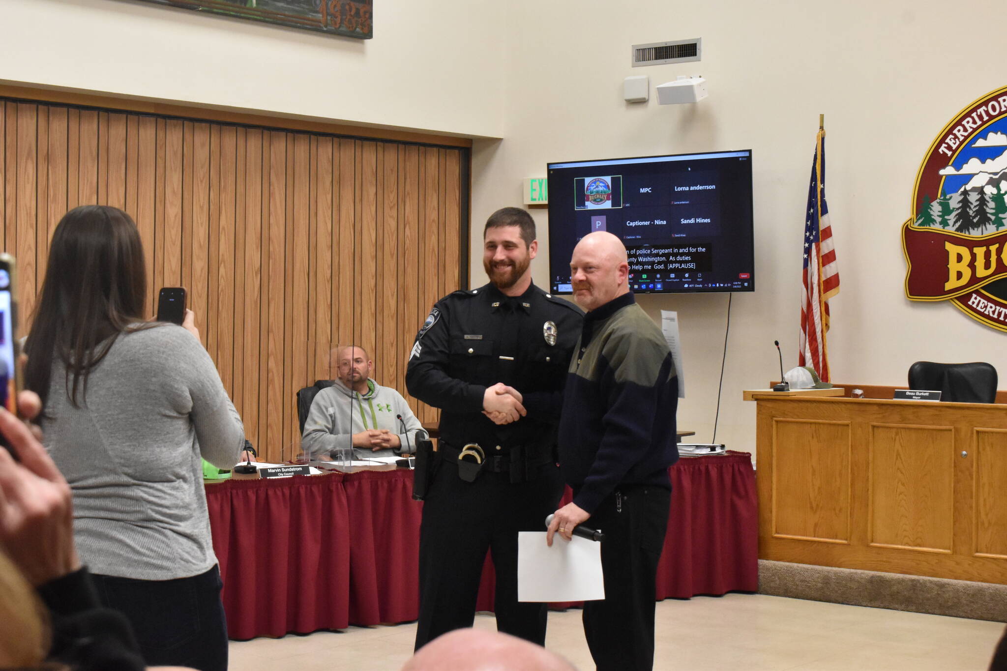 Buckley PD officer Arthur Fetter is promoted to sergeant during the city council meeting March 8. Standing next to him is mayor Beau Burkett. Photo by Alex Bruell.