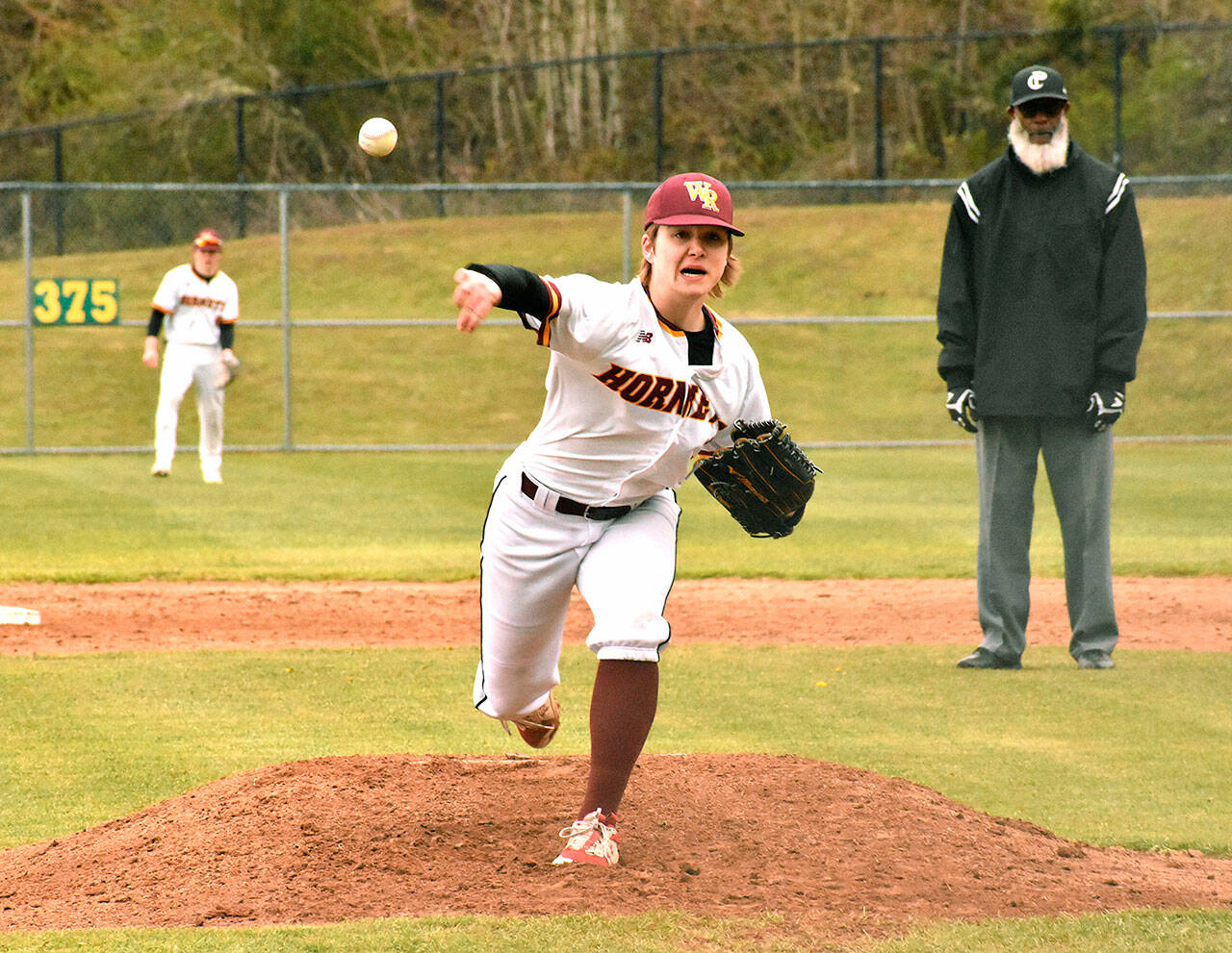 White River sophomore Finn Still delivers during the early stages of a recent Hornet game on the Buckley campus. The squad has a busy week if the weather allows, hosting the Franklin Pierce Cardinals today (Wednesday) and traveling to Fife for a Thursday game against the Trojans before Friday’s Battle of the Bridge showdown against Enumclaw. Friday’s contest for Plateau bragging rights will be played at White River beginning at 4 p.m. Photo by Kevin Hanson