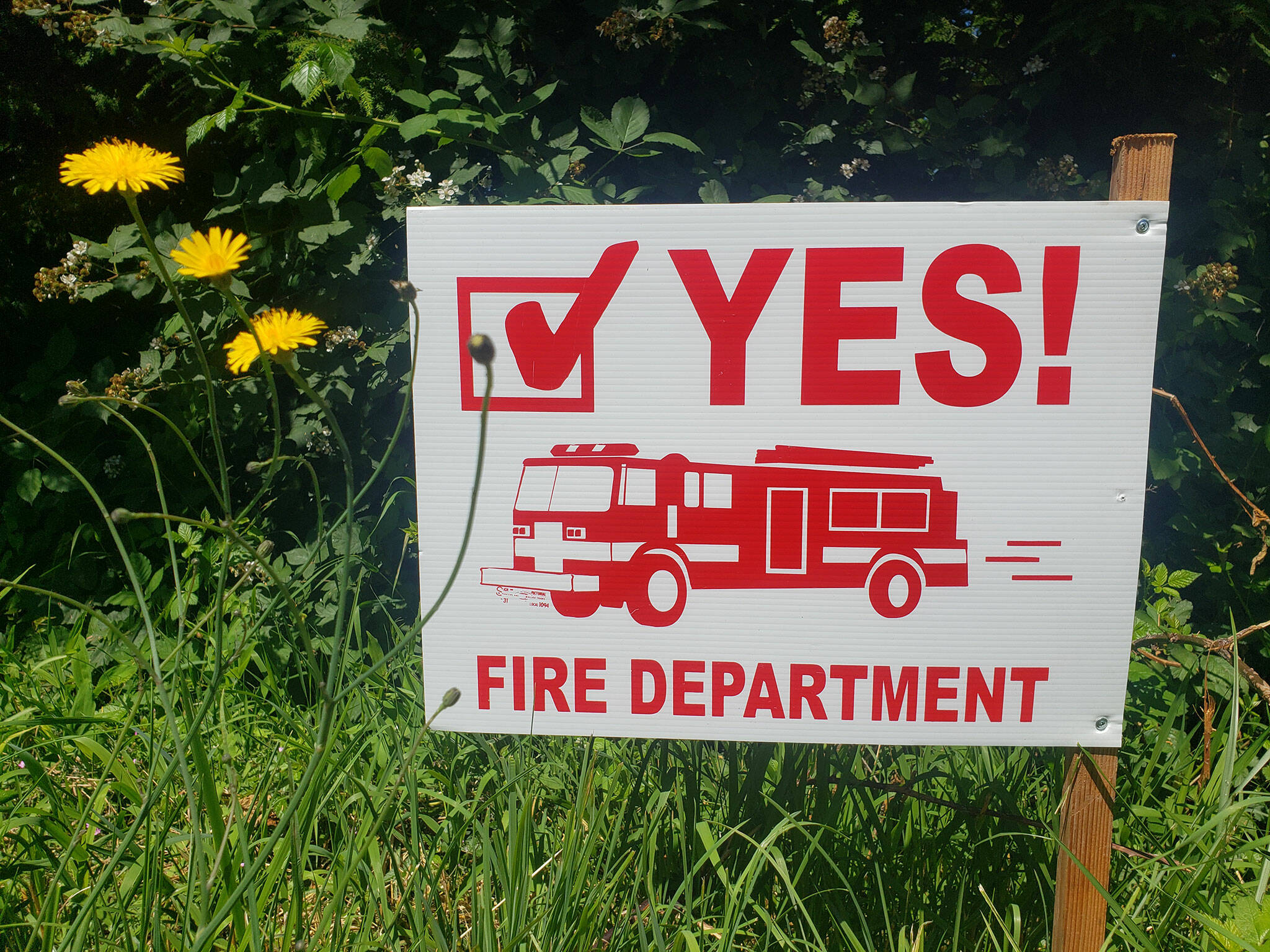 Signs asking locals to support their fire department have gone up around Enumclaw. Photo by Ray Miller-Still