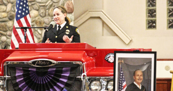 Mountain View Fire and Rescue’s new Fire Chief Dawn Judkins welcomed everyone to former Chief Greg Smith’s Celebration of Life service at the Muckleshoot Pentecostal Church on April 3. Photo by Ray Miller-Still