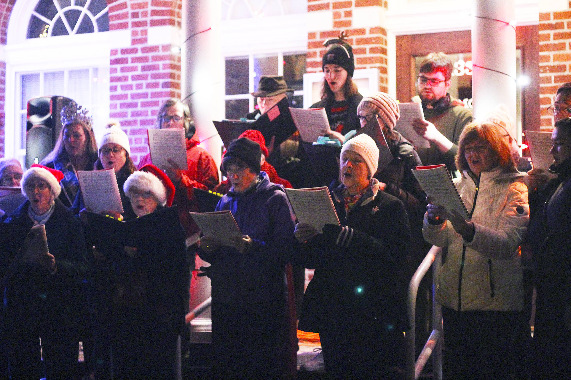 The city of Enumclaw held its annual tree lighting in front of City Hall late last November; here is a previously unpublished photo of a choir singing on the front steps of City Hall. Photo by Ray Miller-Still