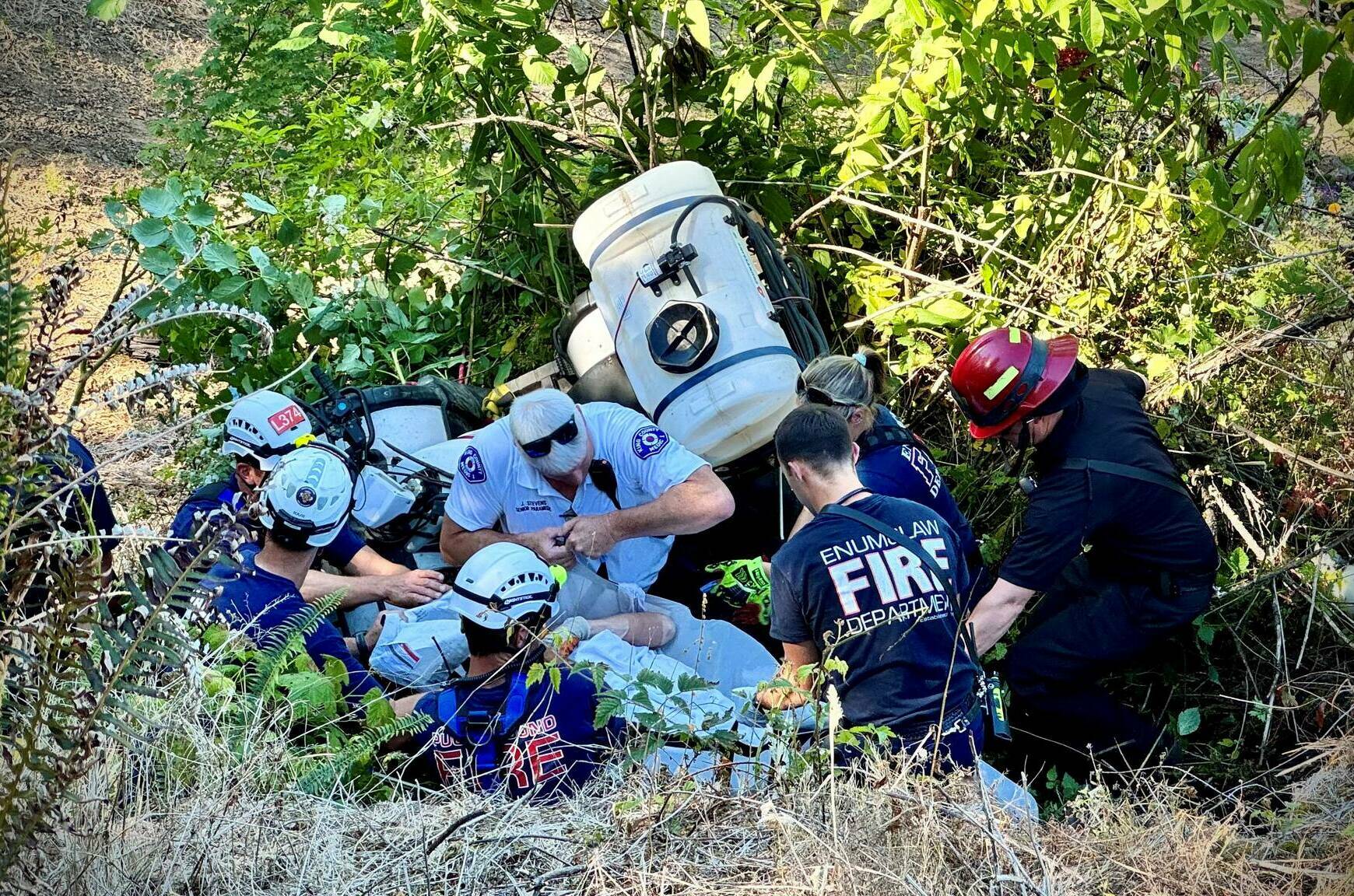 Rescue crews had to hike to rescue a man in a recent ATV rollover. Photo courtesy Enumclaw Fire Department