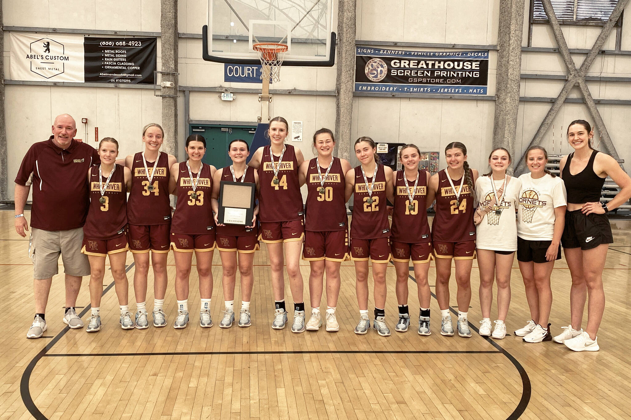 The championship-winning Hornet varsity squad consisted of (from left): head coach Chris Gibson, Malia Froemke, Vivian Kingston, Jadyn Olson, Dakota Sprouse, Emma Voellger, Kaijah Young, Maggee Schmitz, Kaitlyn Hewlett, Myia Olson, Gracie Banks and assistant coaches Megan Cash and Kendall Bird. Contributed photo