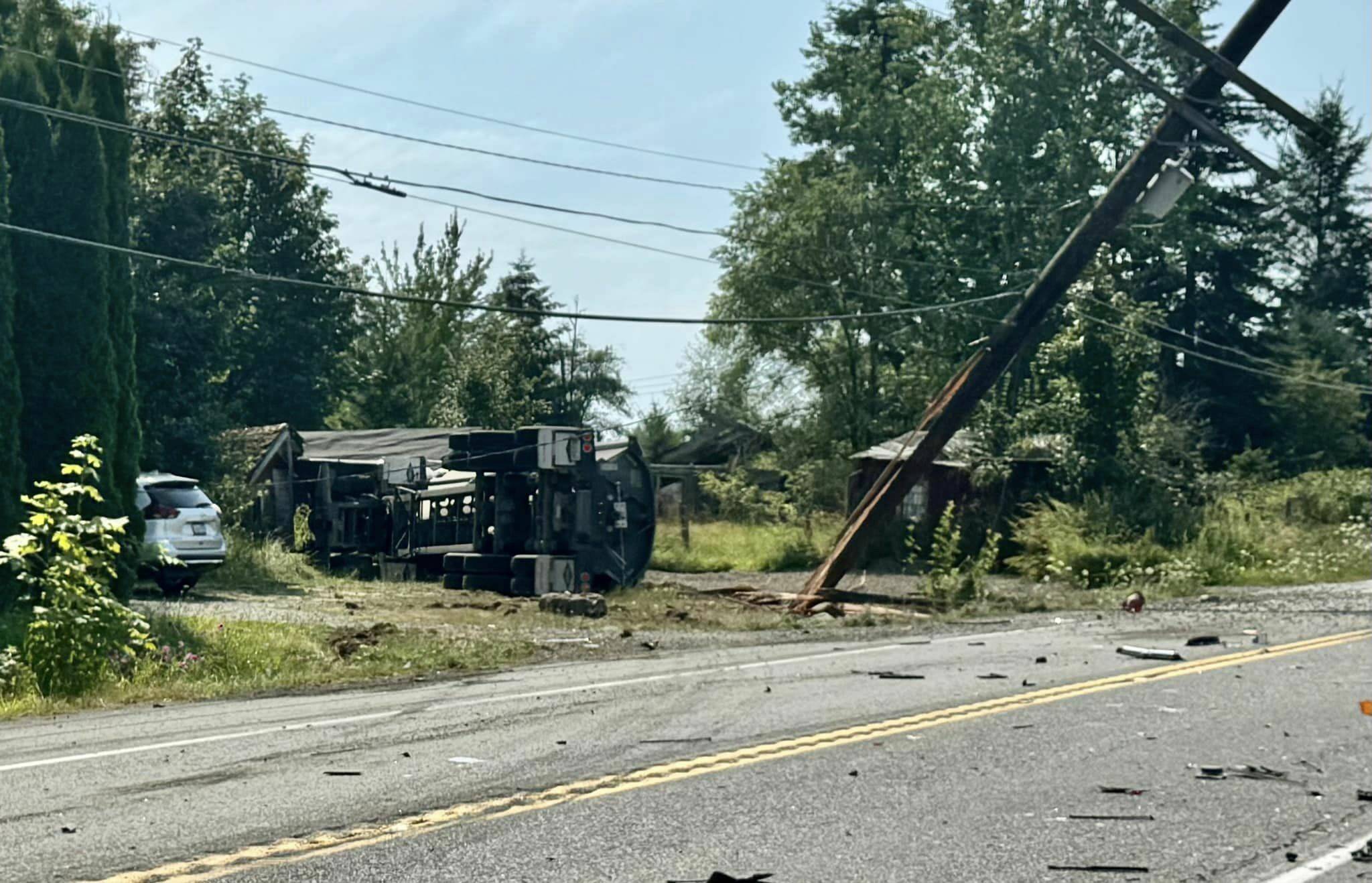 Three people were trapped in their vehicles after a dump truck rolled over and hit an SUV last Friday, Aug. 2. Photo courtesy Enumclaw Fire Department