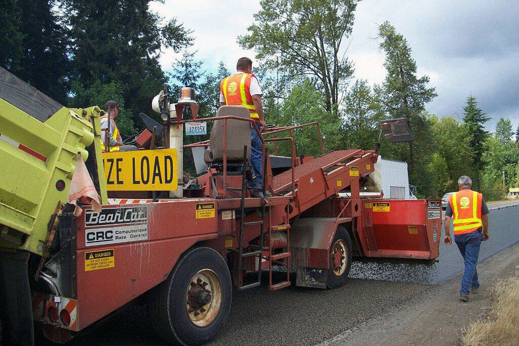 Pierce County crew chip sealing a road. Photo courtesy Pierce County