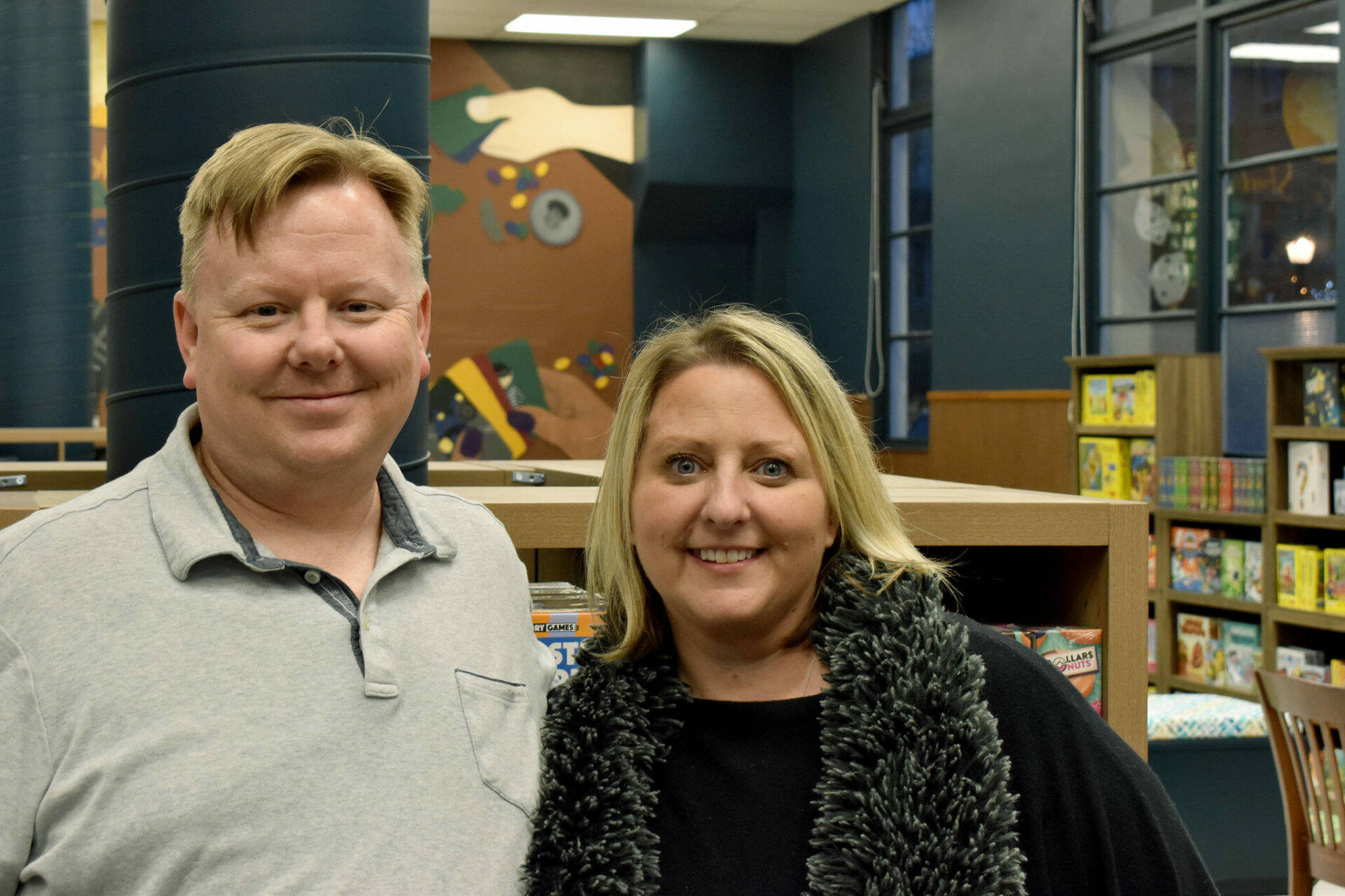 Jan Martinell with her husband, Chad, after opening The Game Vault. Photo by Alex Bruell