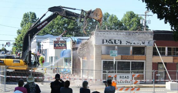 Photos by Ray Miller-Still 
The old Paulson Chevrolet dealership building, which used to be Enumclaw’s first general store, an opera house, Gamblin Motors, and a flooring business over the years, is no longer after demolition crews took down the building on Aug. 28.