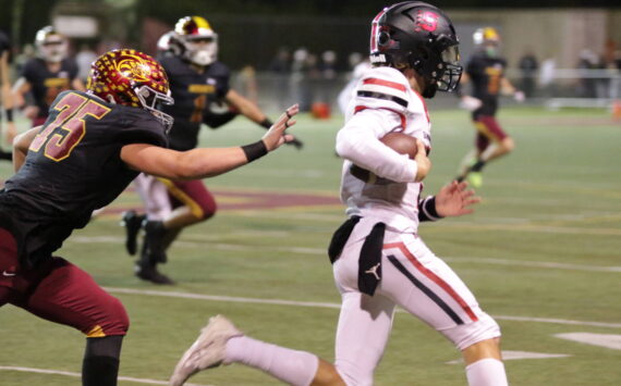 Enumclaw's #75 Ryker Popke continues relentless pursuit be the defense all night against Sammamish. Photo by Todd Overdorf / sonscapeimages.com