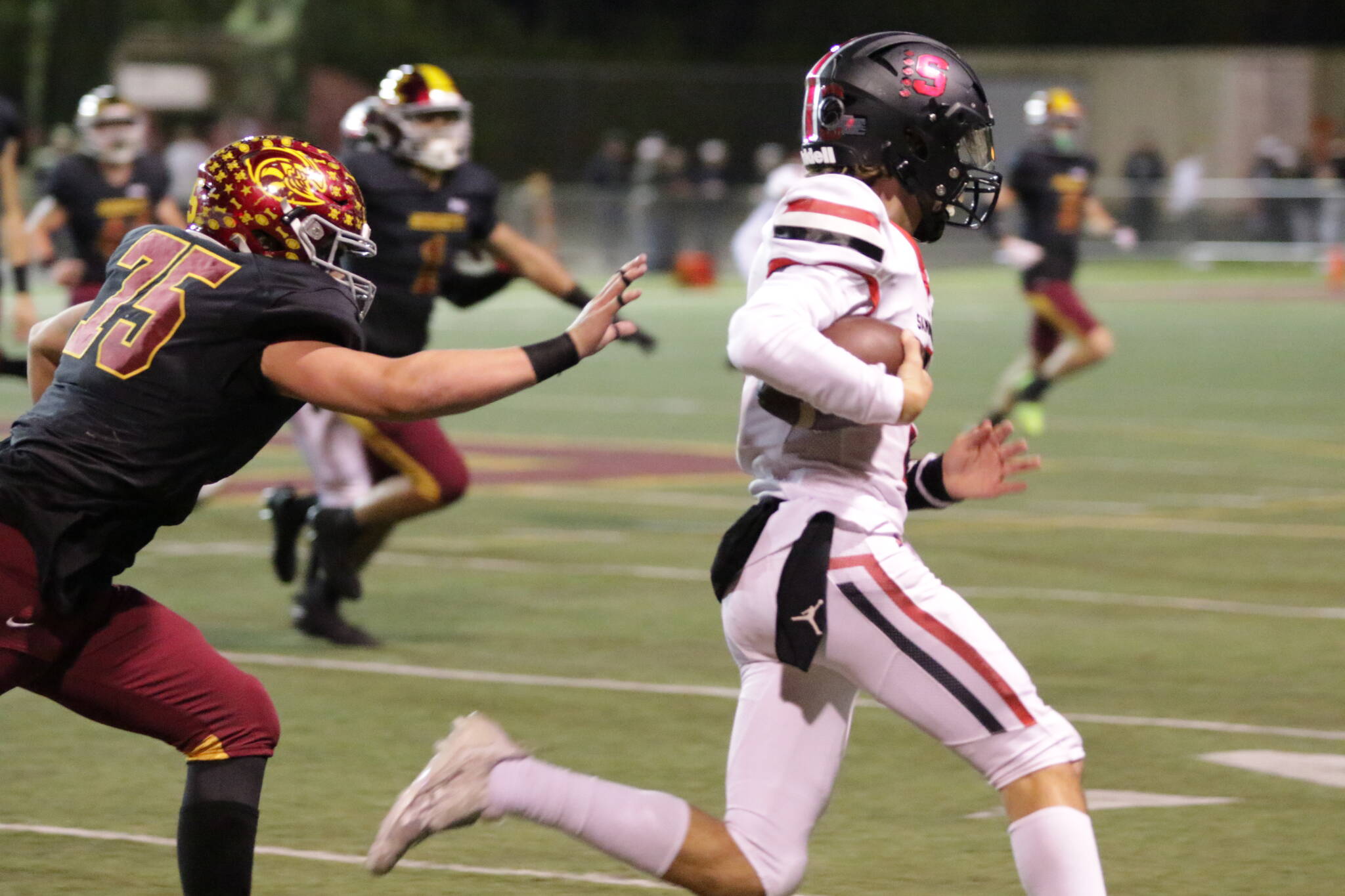 Enumclaw's #75 Ryker Popke continues relentless pursuit be the defense all night against Sammamish. Photo by Todd Overdorf / sonscapeimages.com