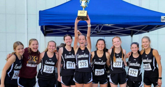 The Enumclaw High girls’ cross country team captured top honors during last year's league meet before heading to districts. Returning this year is Lily Haas (second to last on the right) and Brynne Stafford (last on the right). Contributed photo