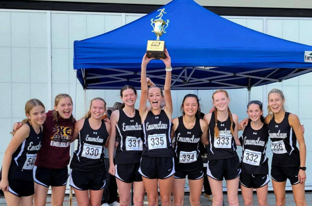 The Enumclaw High girls’ cross country team captured top honors during last year’s league meet before heading to districts. Returning this year is Lily Haas (second to last on the right) and Brynne Stafford (last on the right). Contributed photo