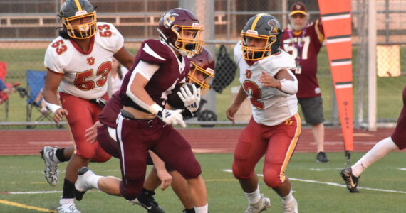 PHOTO BY KEVIN HANSON 
White River scored early and often Friday night, eventually rolling to a huge victory over the visitors from Thomas Jefferson High. In this photo, Trevor King dashes away from Raiders defenders on his way to the Hornets’ first touchdown.