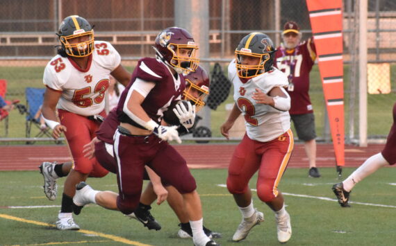 PHOTO BY KEVIN HANSON 
White River scored early and often Friday night, eventually rolling to a huge victory over the visitors from Thomas Jefferson High. In this photo, Trevor King dashes away from Raiders defenders on his way to the Hornets’ first touchdown.