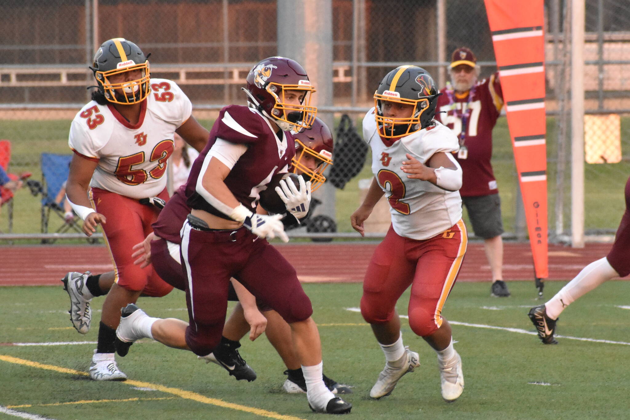 PHOTO BY KEVIN HANSON 
White River scored early and often Friday night, eventually rolling to a huge victory over the visitors from Thomas Jefferson High. In this photo, Trevor King dashes away from Raiders defenders on his way to the Hornets’ first touchdown.