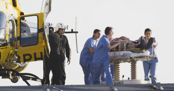 Medical personnel rushing a patient from helicopter. Image courtesy Metro Creative Connections