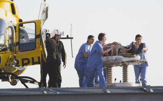 Medical personnel rushing a patient from helicopter. Image courtesy Metro Creative Connections