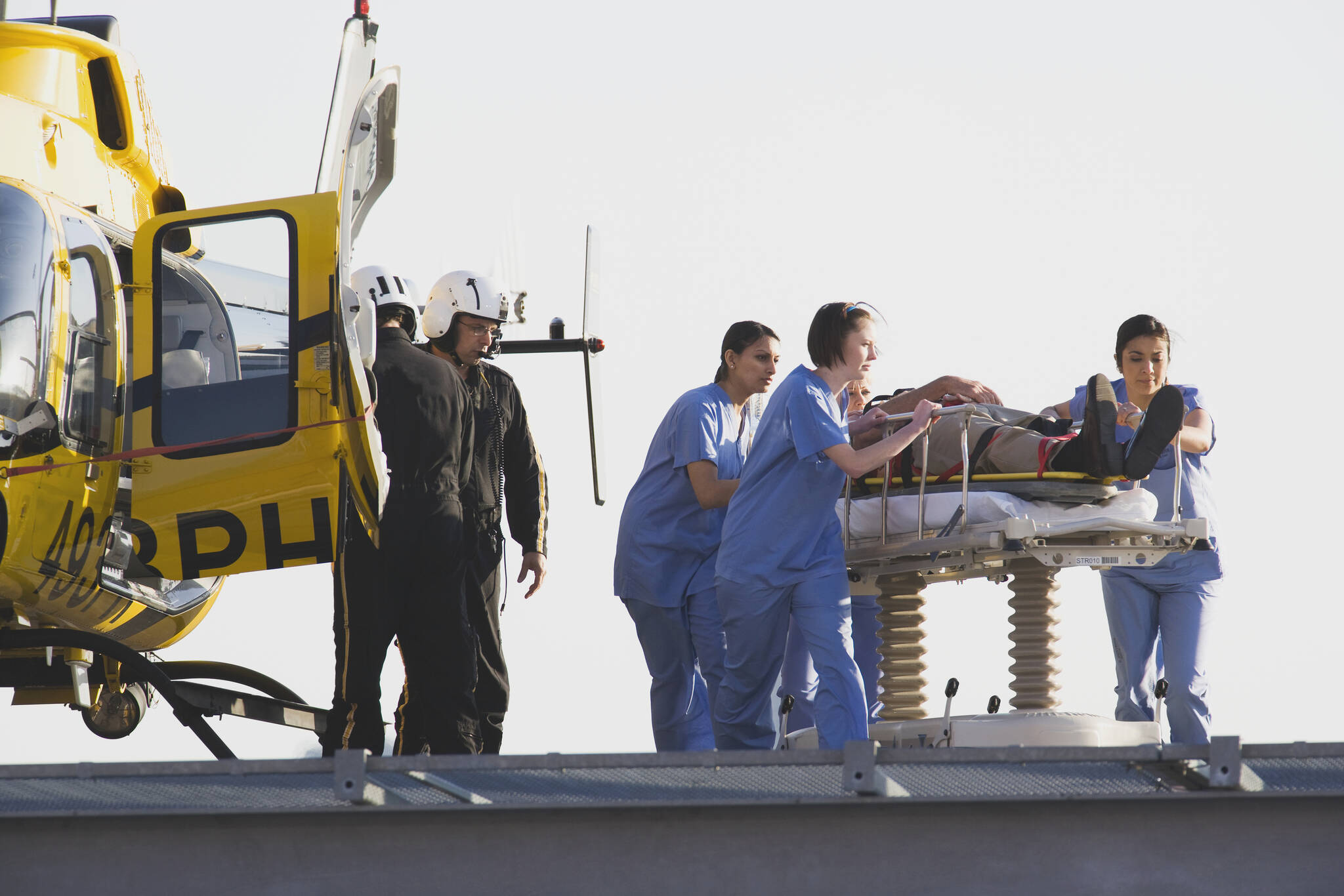 Medical personnel rushing a patient from helicopter. Image courtesy Metro Creative Connections