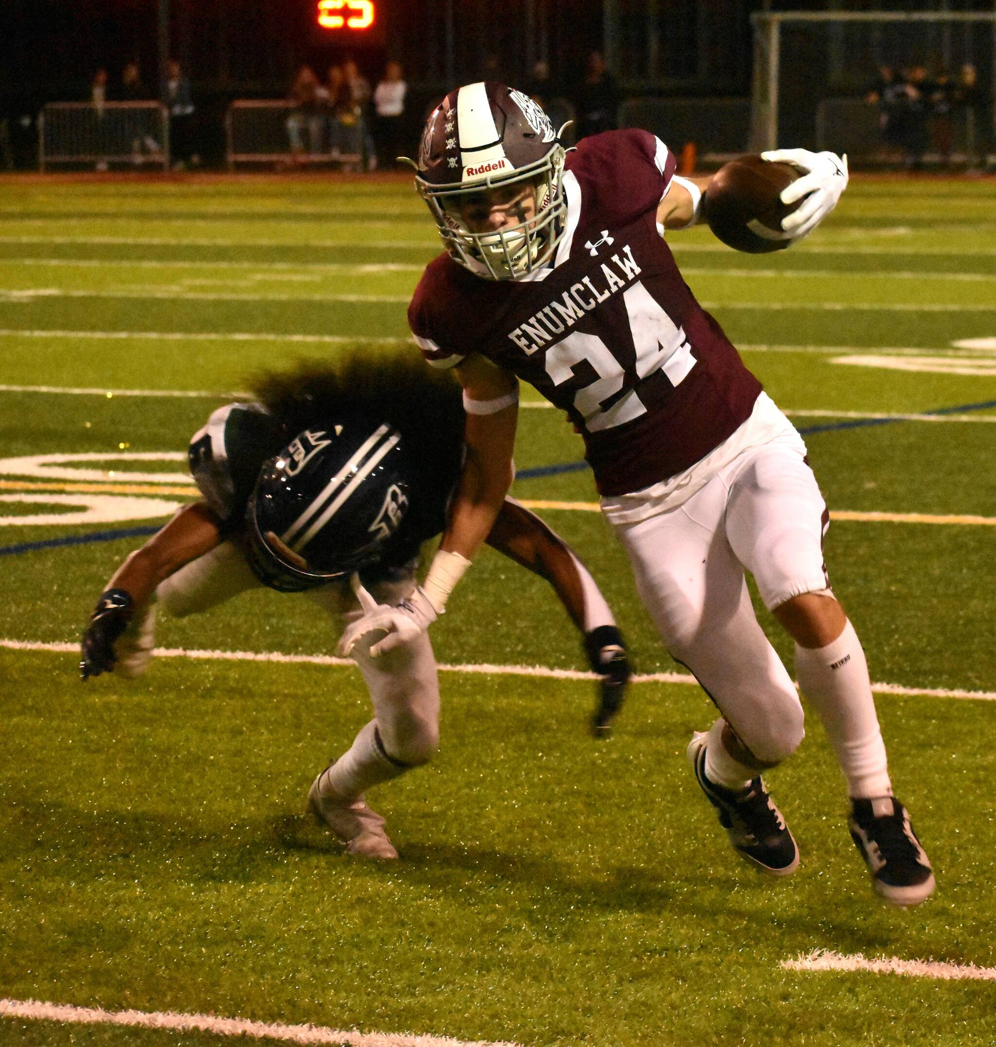 PHOTO BY KEVIN HANSON
Senior Louis Chevalier was among the many Hornet stars Friday night when Enumclaw High crushed the visiting Todd Beamer squad. Here, he evades a would-be Titan tackler during a second-half dash.