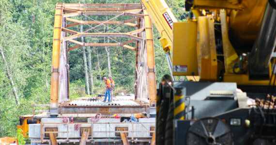 Construction crews working on the Foothills Bridge last August. Photo by Ray Miller-Still