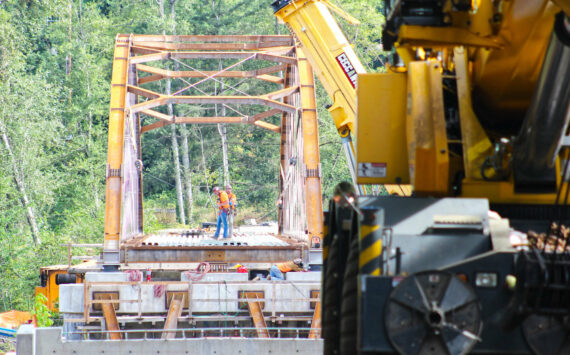 Construction crews working on the Foothills Bridge last August. Photo by Ray Miller-Still