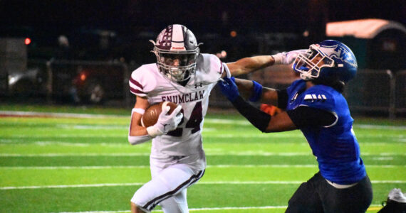 Ben Ray / The Reporter
Enumclaw senior RB Louis Chevalier stiff arms an Eagle defender.