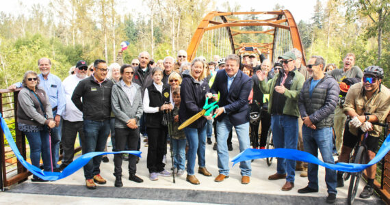 Photo by Ray Miller-Still
The crowd at the Foothills Trail bridge grand opening last Saturday found themselves practically shoulder to shoulder as they gathered on the new structure for the ribbon cutting. The bridge now connects pedestrians from Enumclaw and Buckley, and doubles as an emergency route for first responders of the traffic bridge fails.