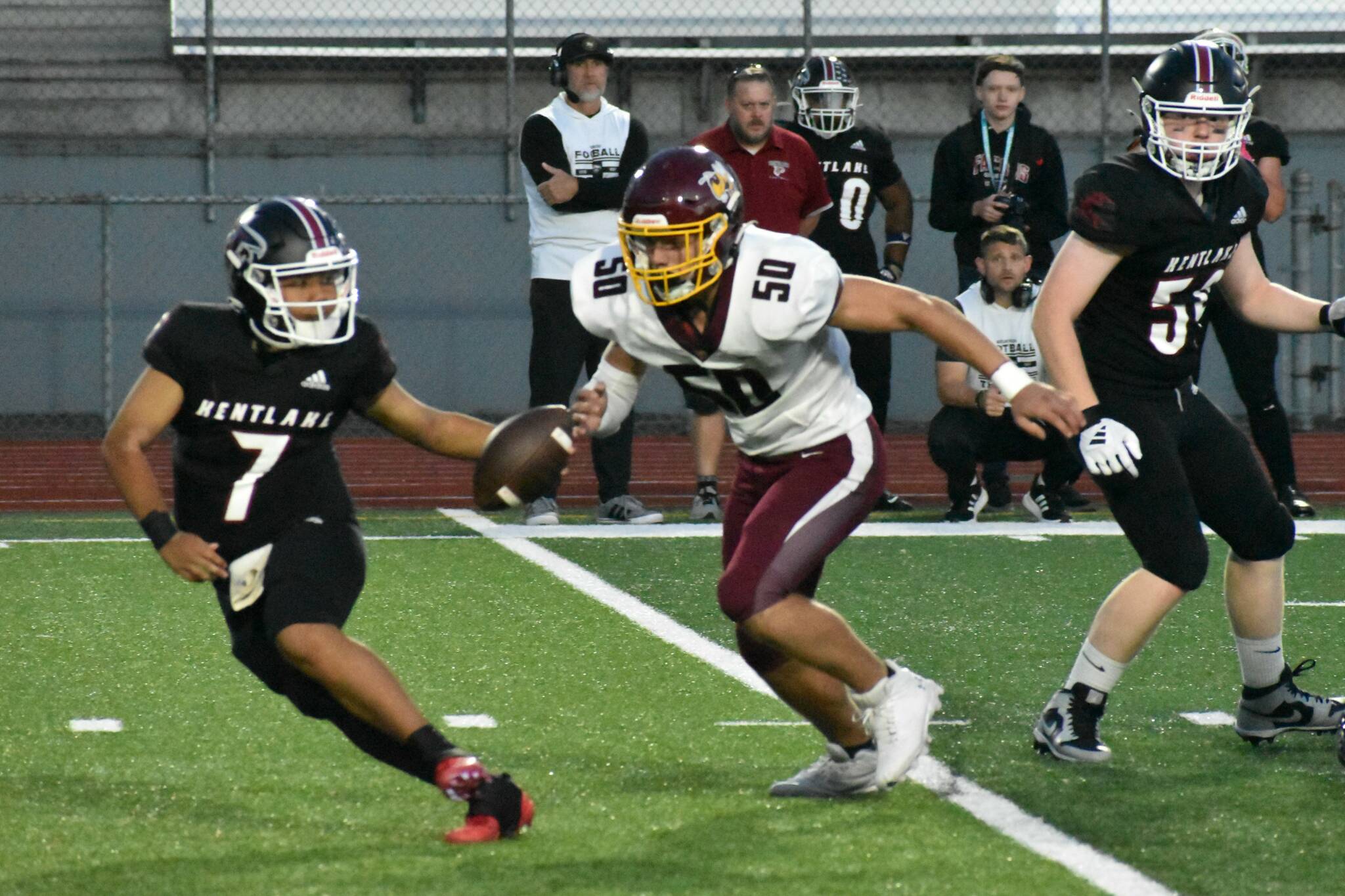 The White River Hornets dominated both sides of the line of scrimmage the evening of October 3, trouncing the Kentlake Falcons 54-7. Pictured is WRHS’ Gavin Parish pressuring Kentlake quarterback Gavin Leenhiavue.
Photo by Kevin Hanson