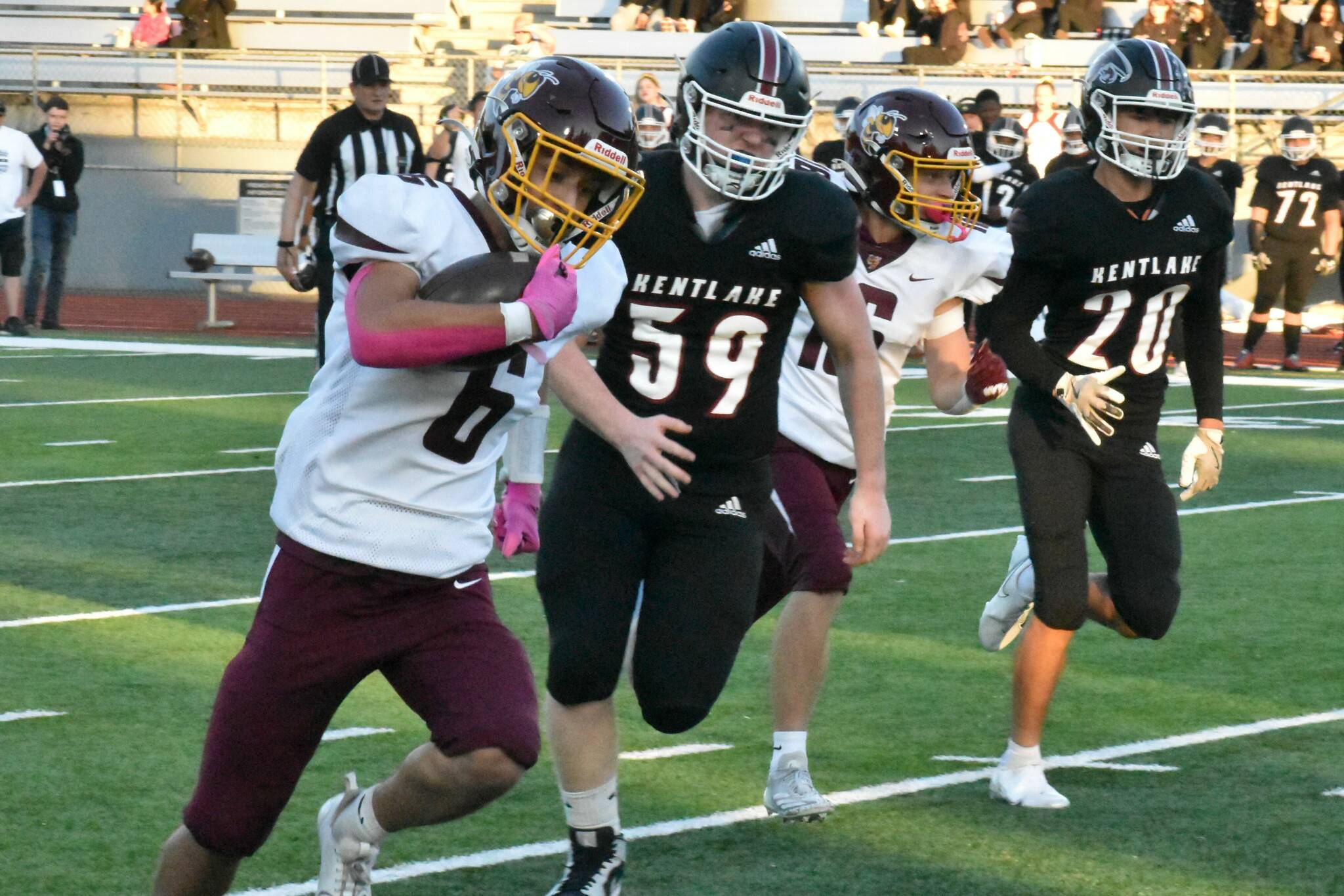 Hornet Hunter Maris runs for big yardage against the Falcons and linebacker. For more information about how local football teams performed, head to <a href="https://www.courierherald.com/sports/ehs-wrhs-continue-to-bulldoze-through-npsl-3a-teams/" target="_blank">EHS, WRHS continue to bulldoze through NPSL 3A teams</a>. Photo by Kevin Hanson