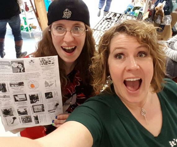 Alisa Garate (right) with a shopper showing off the Hungry Housewives vendor brochure during the 2016 event. This year’s craft show features more than 100 vendors. Photo courtesy Alisa Garate