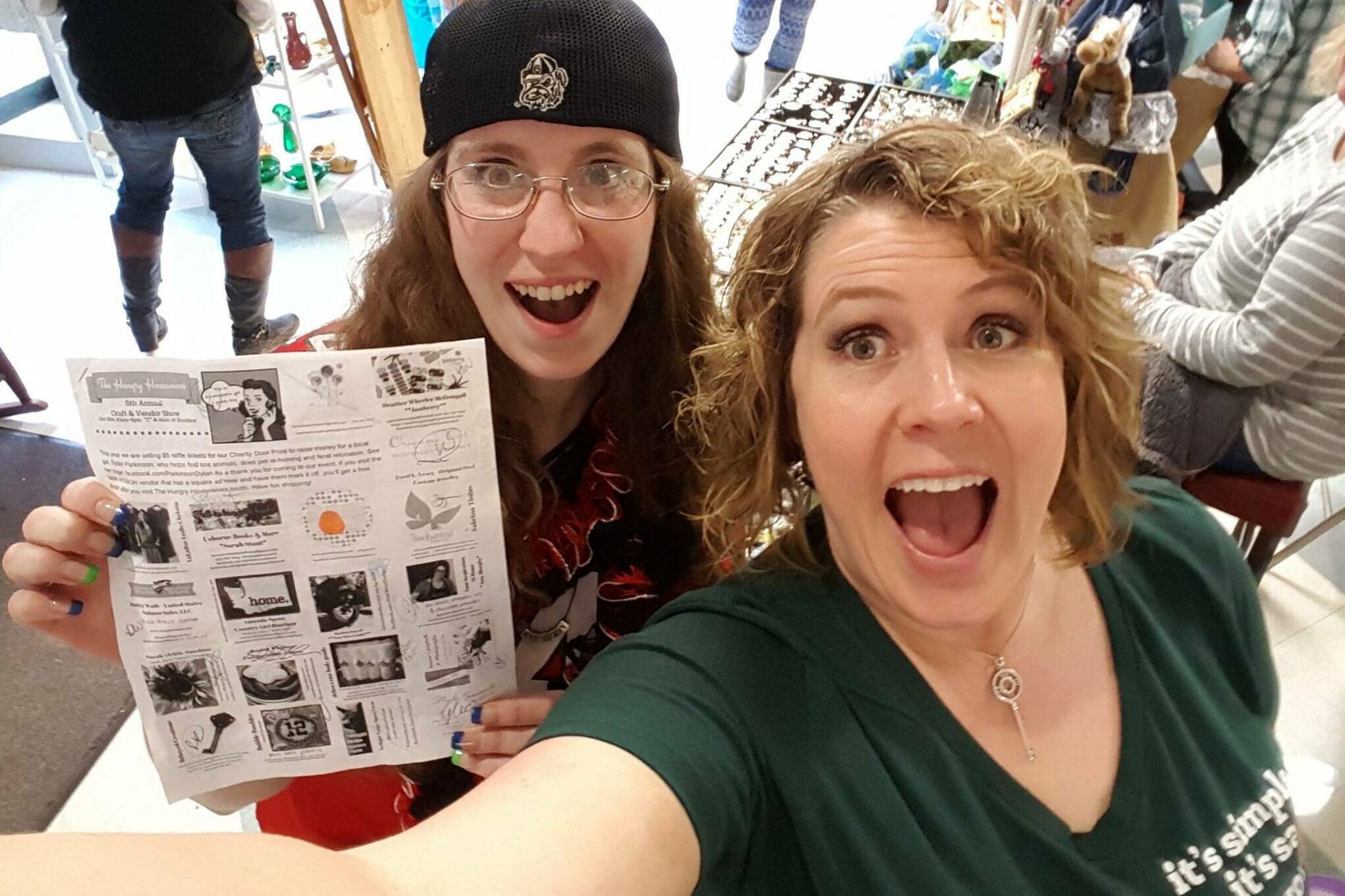 Alisa Garate (right) with a shopper showing off the Hungry Housewives vendor brochure during the 2016 event. This year’s craft show features more than 100 vendors. Photo courtesy Alisa Garate