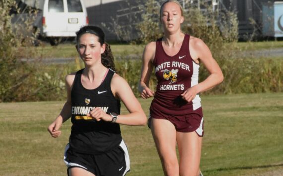 PHOTO BY KEVIN HANSON
Enumclaw and White River squared off in cross country action last week, running the 5K course in Enumclaw. Pictured here are Enumclaw's Lillian Haas and White River's Vivian Kingston who placed second and third, respectively, in the girls race. Full details from the 3A NPSL meet can be found in Sports Roundup.