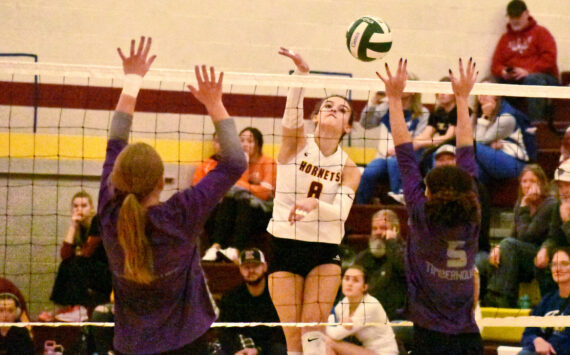 PHOTO BY KEVIN HANSON 
White River’s Marli Miller (8) blasts home a point during her team’s victory over Heritage High.