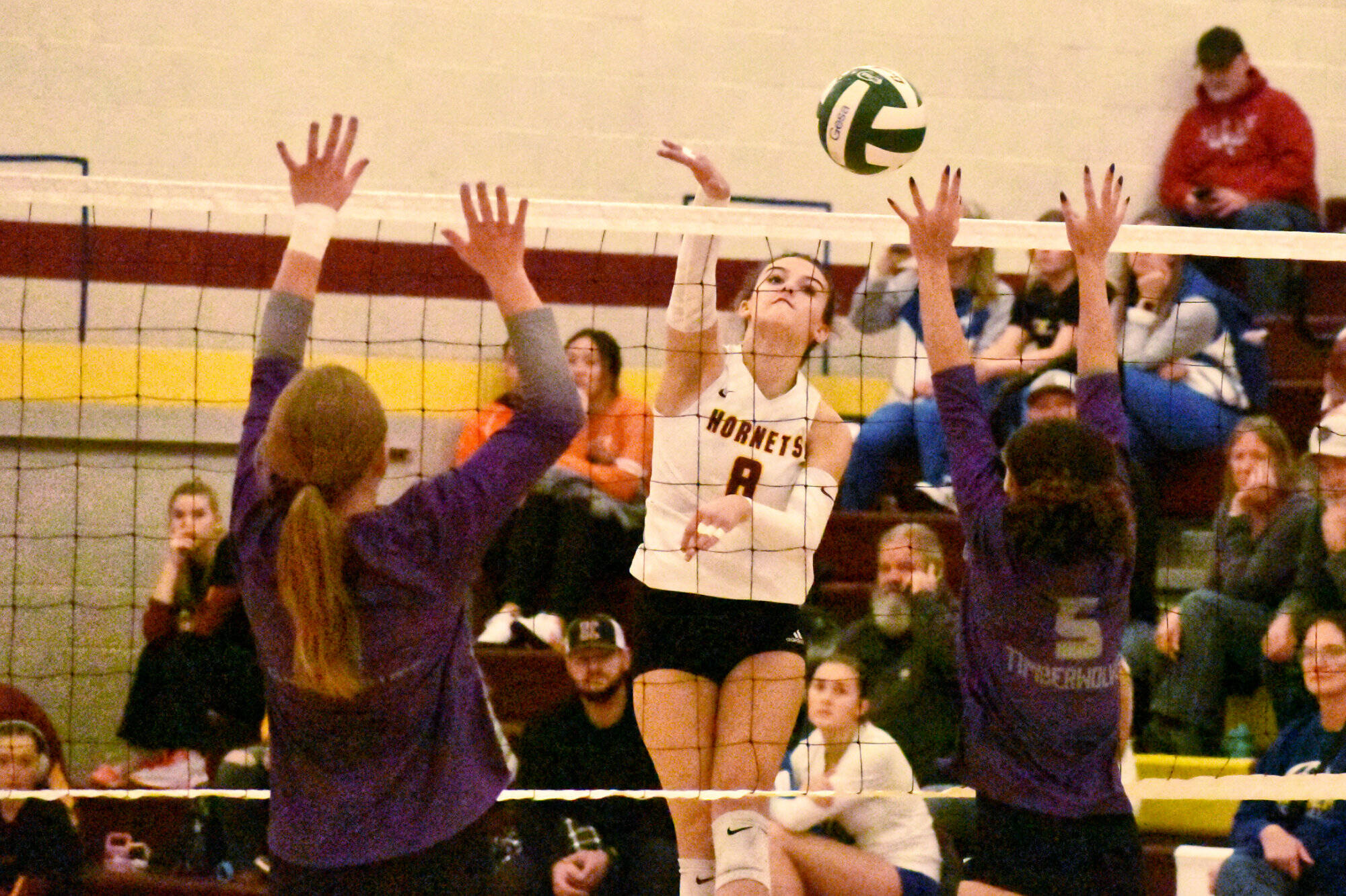 PHOTO BY KEVIN HANSON White River’s Marli Miller (8) blasts home a point during her team’s victory over Heritage High.