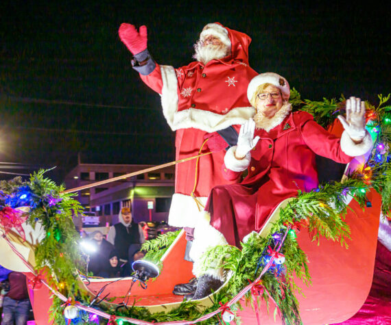 <p>Photos by Vic Wright / vicwright.zenfolio.com</p>
                                <p>Hundreds of people bundled gathered along Enumclaw’s Cole Street to celebrate the Christmas season with the Chamber of Commerce’s annual Santa Parade, and the festivities could be heard far beyond downtown. Floats traveled down the street for more than an hour and featured local businesses, school clubs, and familiar characters like the Grinch and Santa Claus (who, as we reported last week, no longer vacations in Enumclaw, but of course he still attended the event). The festivities continue on Dec. 14 with the Chamber’s last 5 p.m. Snow on Cole event. For more photos of the parade, go to page 8. </p>