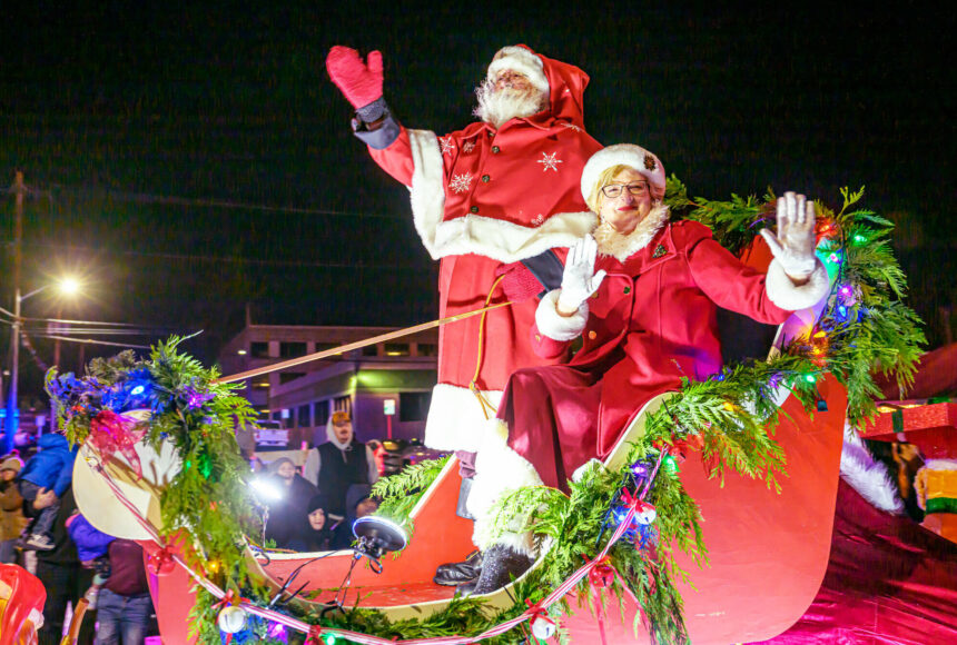 <p>Photos by Vic Wright / vicwright.zenfolio.com</p>
                                <p>Hundreds of people bundled gathered along Enumclaw’s Cole Street to celebrate the Christmas season with the Chamber of Commerce’s annual Santa Parade, and the festivities could be heard far beyond downtown. Floats traveled down the street for more than an hour and featured local businesses, school clubs, and familiar characters like the Grinch and Santa Claus (who, as we reported last week, no longer vacations in Enumclaw, but of course he still attended the event). The festivities continue on Dec. 14 with the Chamber’s last 5 p.m. Snow on Cole event. For more photos of the parade, go to page 8. </p>