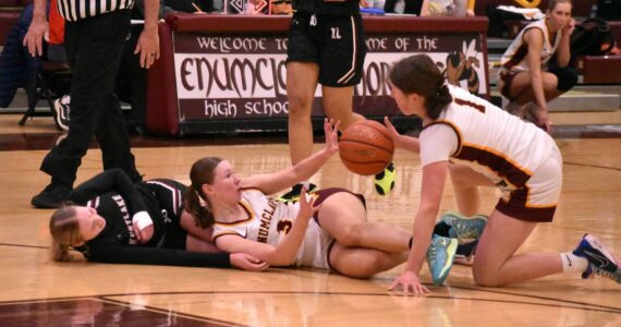 PHOTOS BY KEVIN HANSON 
The Enumclaw High girls had little trouble defeating the visiting Kentlake Falcons the evening of Dec.12, leading from the opening seconds and eventually posting a 65-28 victory. In this photo, Hornets Kalee Swanson (3) and Kaidyn Johnson (1) scramble for a loose ball.