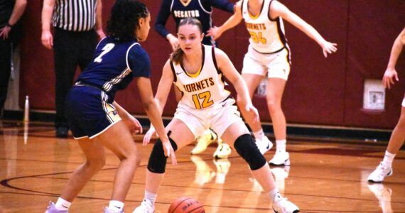 PHOTO BY KEVIN HANSON The White River High girls were tested by Decatur High the evening of Dec. 17 but used a third-quarter advantage to eventually register a 54-44 victory during their 3A North Puget Sound League encounter. The Golden Gators led 30-29 at intermission, but the Hornets outscored the visitors 16-4 during the third period to take control. Here, Gracie Banks (12) applies defensive pressure. After participating in a holiday tournament in Lynden the team will take a break, then resume league play when they host Enumclaw High on Jan. 8.