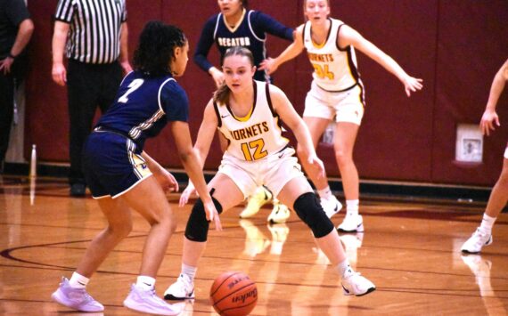 PHOTO BY KEVIN HANSON The White River High girls were tested by Decatur High the evening of Dec. 17 but used a third-quarter advantage to eventually register a 54-44 victory during their 3A North Puget Sound League encounter. The Golden Gators led 30-29 at intermission, but the Hornets outscored the visitors 16-4 during the third period to take control. Here, Gracie Banks (12) applies defensive pressure. After participating in a holiday tournament in Lynden the team will take a break, then resume league play when they host Enumclaw High on Jan. 8.