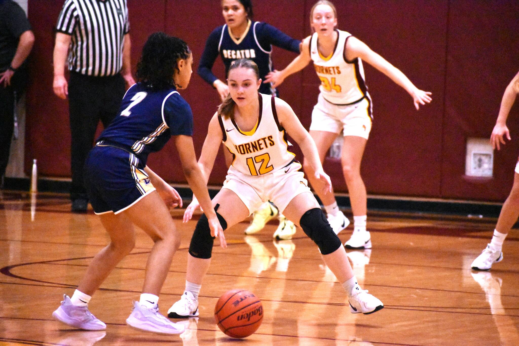 PHOTO BY KEVIN HANSON The White River High girls were tested by Decatur High the evening of Dec. 17 but used a third-quarter advantage to eventually register a 54-44 victory during their 3A North Puget Sound League encounter. The Golden Gators led 30-29 at intermission, but the Hornets outscored the visitors 16-4 during the third period to take control. Here, Gracie Banks (12) applies defensive pressure. After participating in a holiday tournament in Lynden the team will take a break, then resume league play when they host Enumclaw High on Jan. 8.