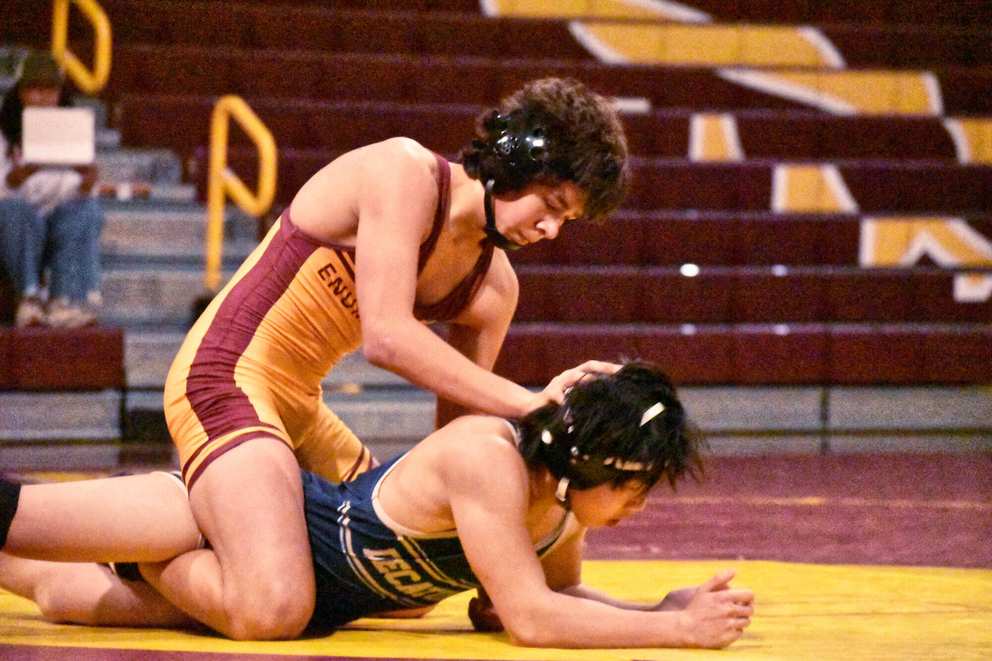 PHOTO BY KEVIN HANSON The Enumclaw High boys wrestling team managed to fit a couple of tournaments into its schedule during the holidays and will return to action Jan. 8 with a dual meet at Kent-Meridian High School. The White River boys had one tourney during winter break and also will return to the mat Jan. 8 when they travel to Federal Way High to challenge the Eagles. In this photo from Enumclaw’s Dec. 18 victory over visiting Decatur High, Romeo Gwerder (black headgear) dominates their Gator opponents. He registered a 19-2 technical fall.