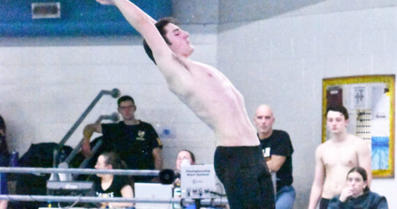 The swim and dive teams from Enumclaw High and White River took on the Federal Way Eagles on Jan. 16. Among those competing at the Enumclaw Aquatic Center was EHS diver Riley Jensen. Photo by Kevin Hanson