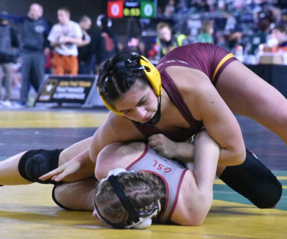 Photo by Kevin Hanson
White River’s Lilyana Lamothe pinned all four of her opponents during Mat Classic, earning a Class 3A championship in the 130-pound division. In this photo, she dominates Mariah Denney from University High (Spokane Valley).